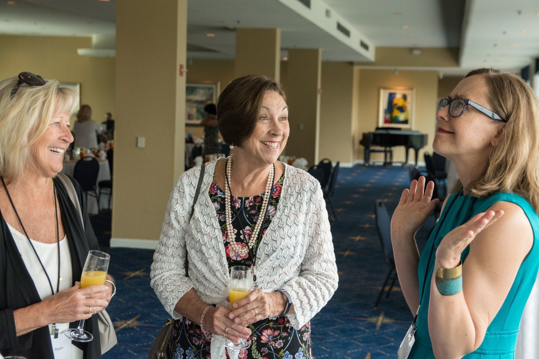 Attendees of the event chat before the luncheon.